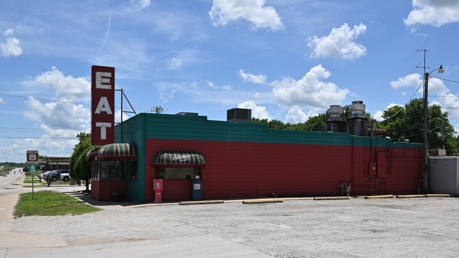 Brick front of Clanton's Cafe in Vinita, Oklahoma, with a tall EAT sign on the building