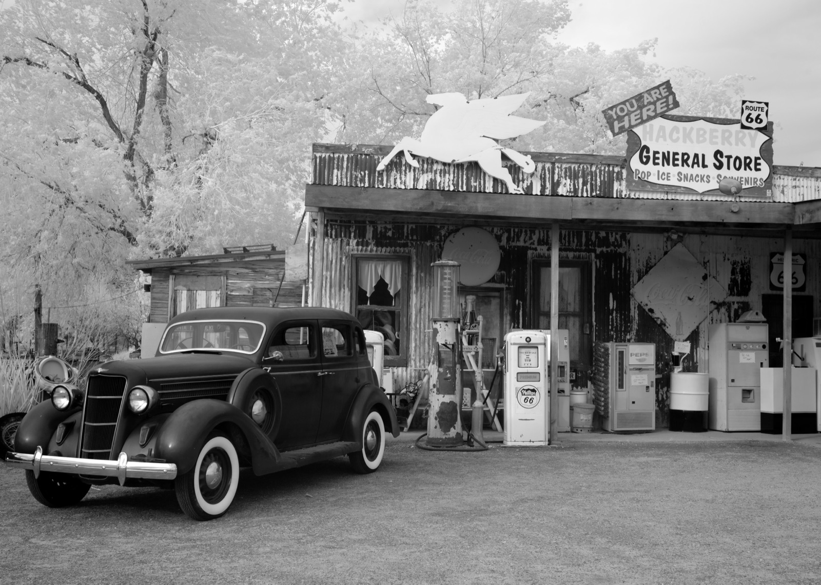 The Hackberry General Store on Route 66 in Arizona, with an old car and vintage signs out front