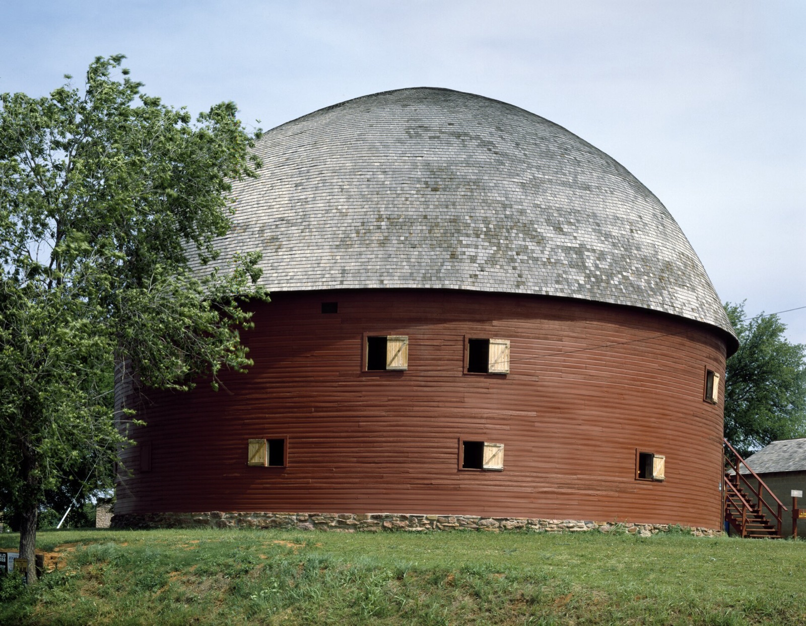 The red Round Barn in Arcadia, Oklahoma, with its domed shingle roof